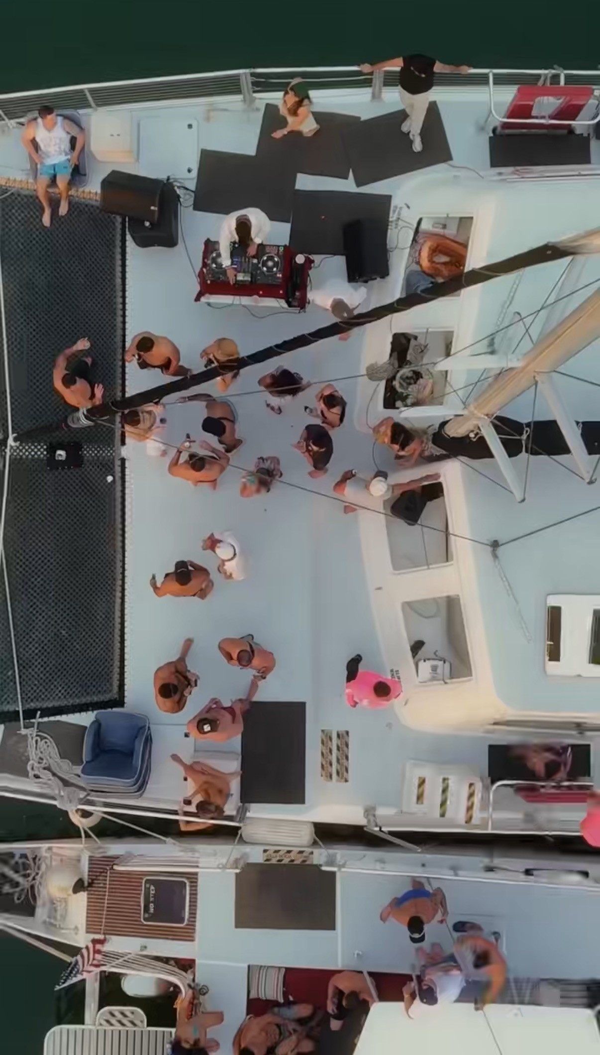 man standing near cliff looking at body of water during daytime