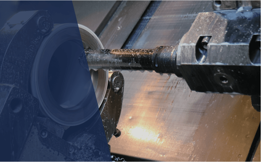 A presenter stands in front of a group, discussing a topic, with a digital screen displaying content behind them.