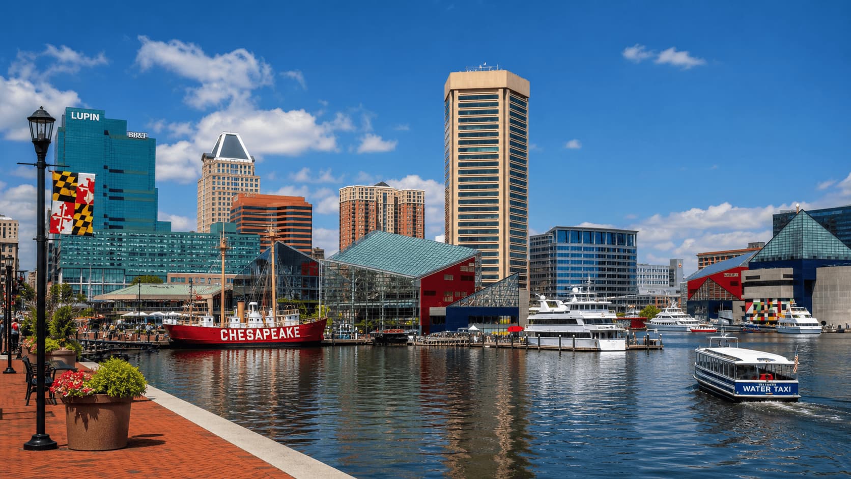 Baltimore Inner Harbor with waterfront buildings and boats on a sunny day