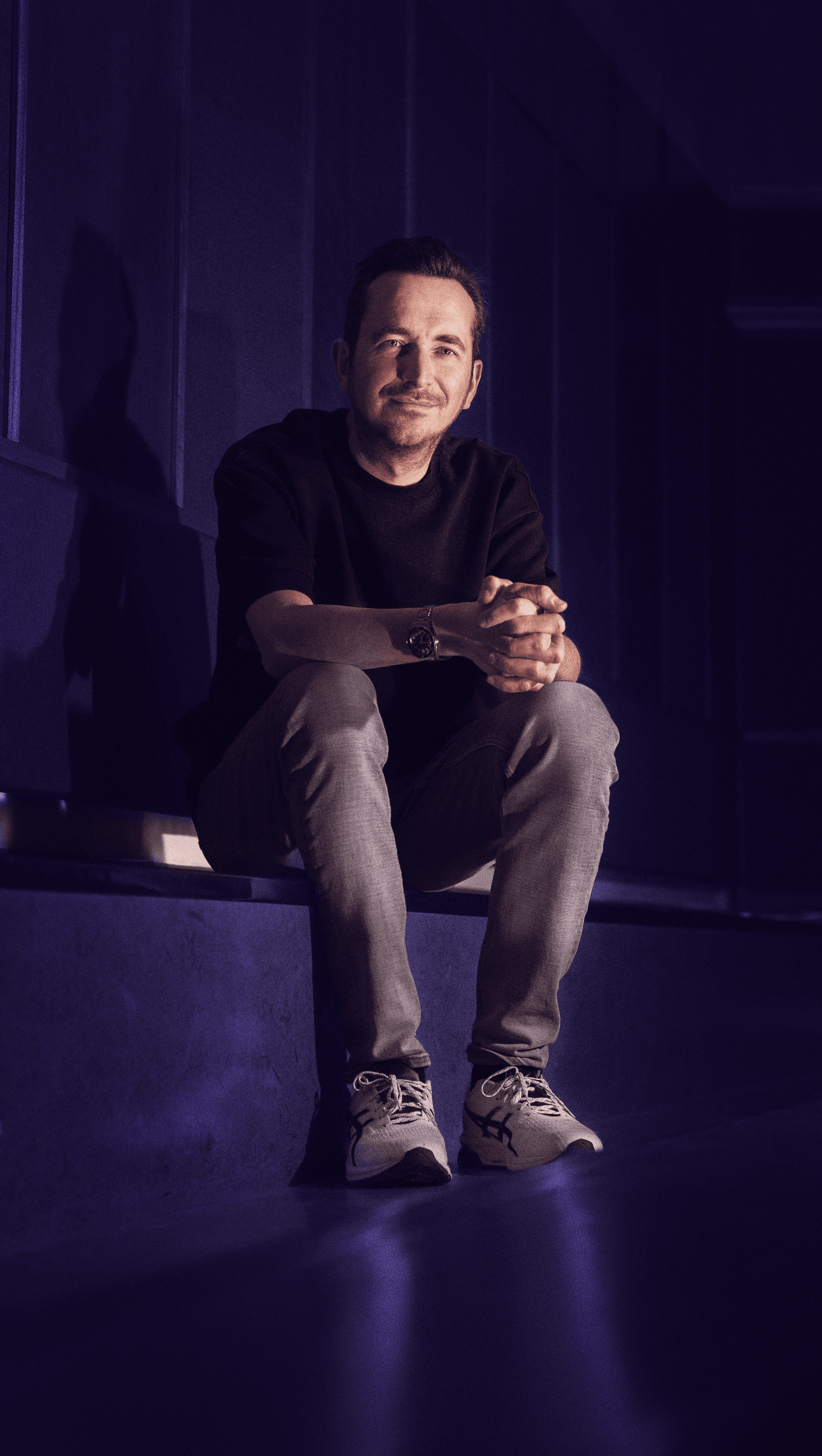 Music producer sitting in his studio