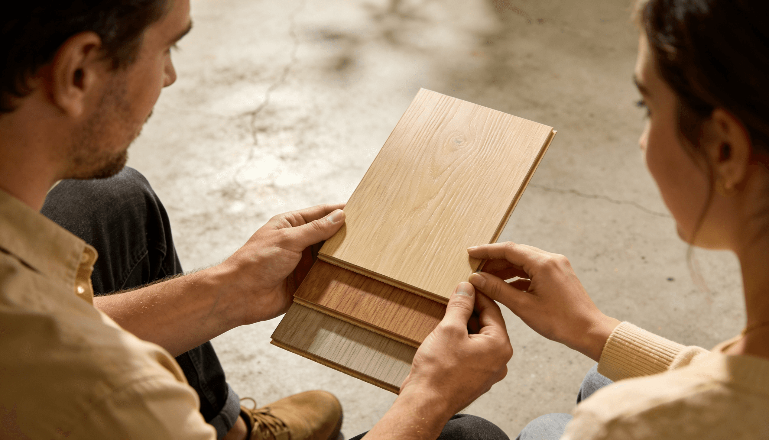 Brisbane flooring buyers choosing light oak hybrid flooring samples for a home renovation project