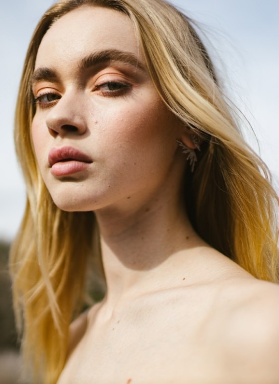 Profile portrait with natural lighting featuring long blonde hair