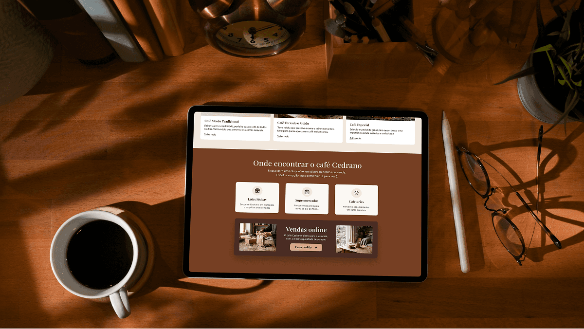 Portrait of a woman with curly hair wearing a two-tone gray and orange beanie against a neutral background.