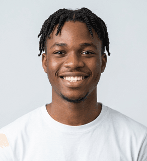 man in green crew neck shirt and black hat