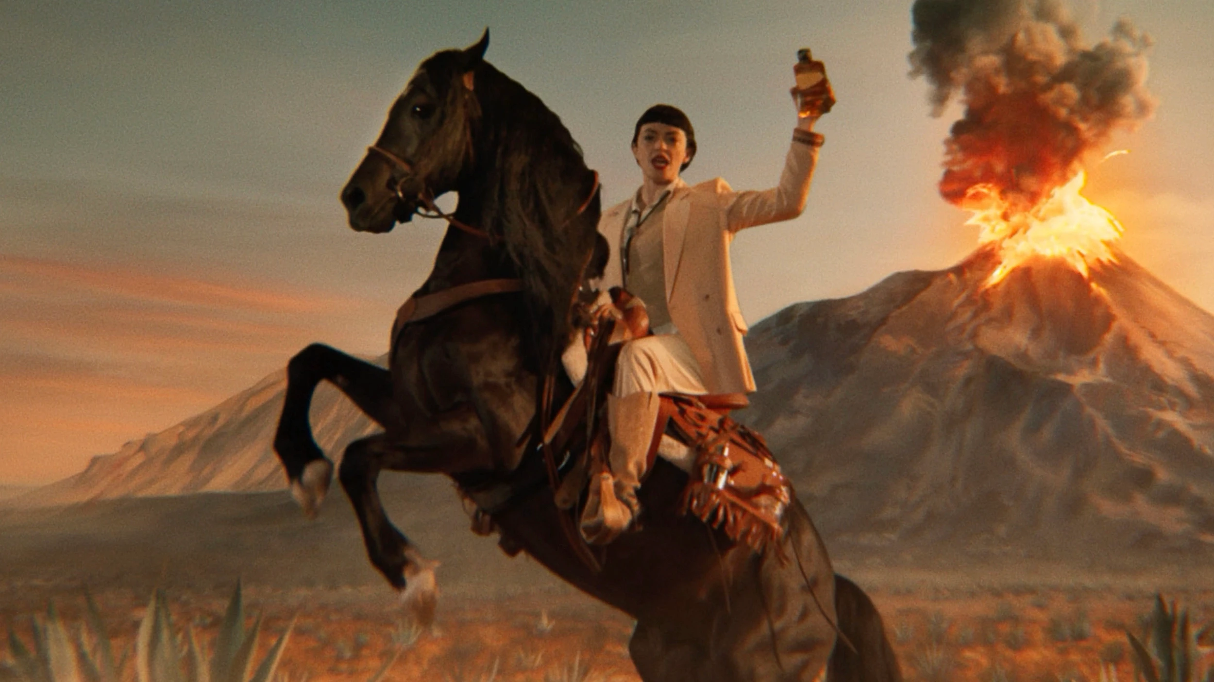 Woman on horse in front of volcano.