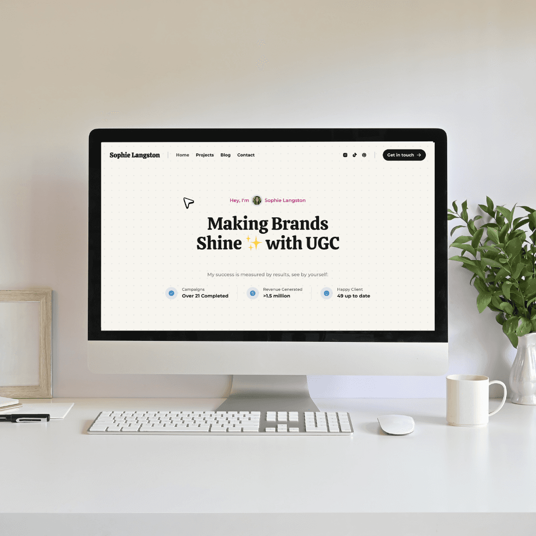 A laptop sits on a chair, displaying a webpage with text that reads "Great Articles - Read | Share."