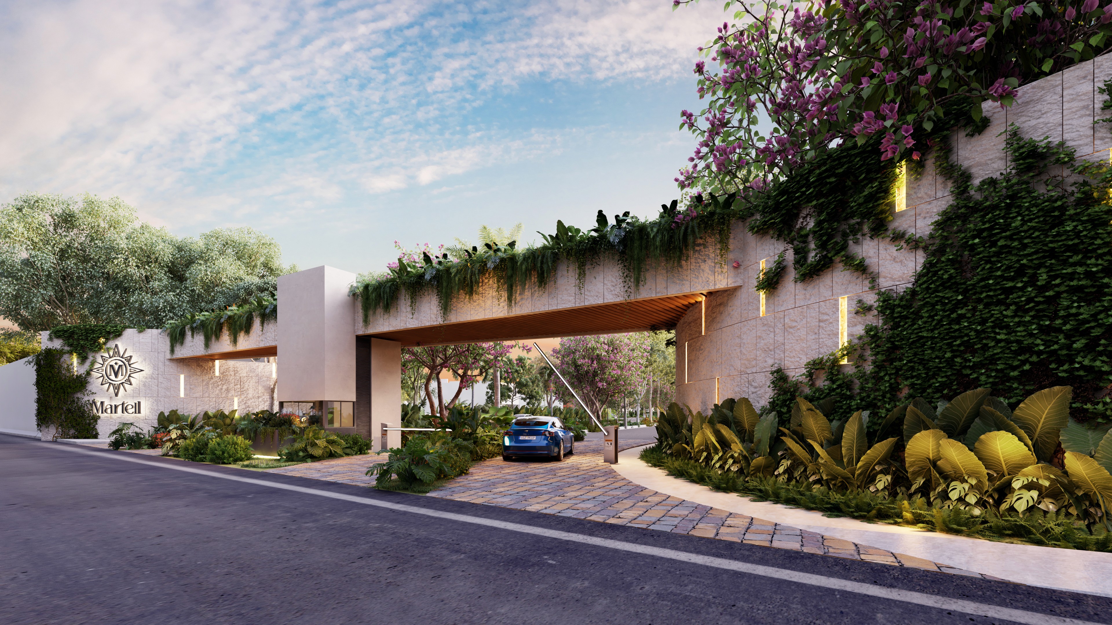 A valley with small buildings surrounded by snow-capped mountains.