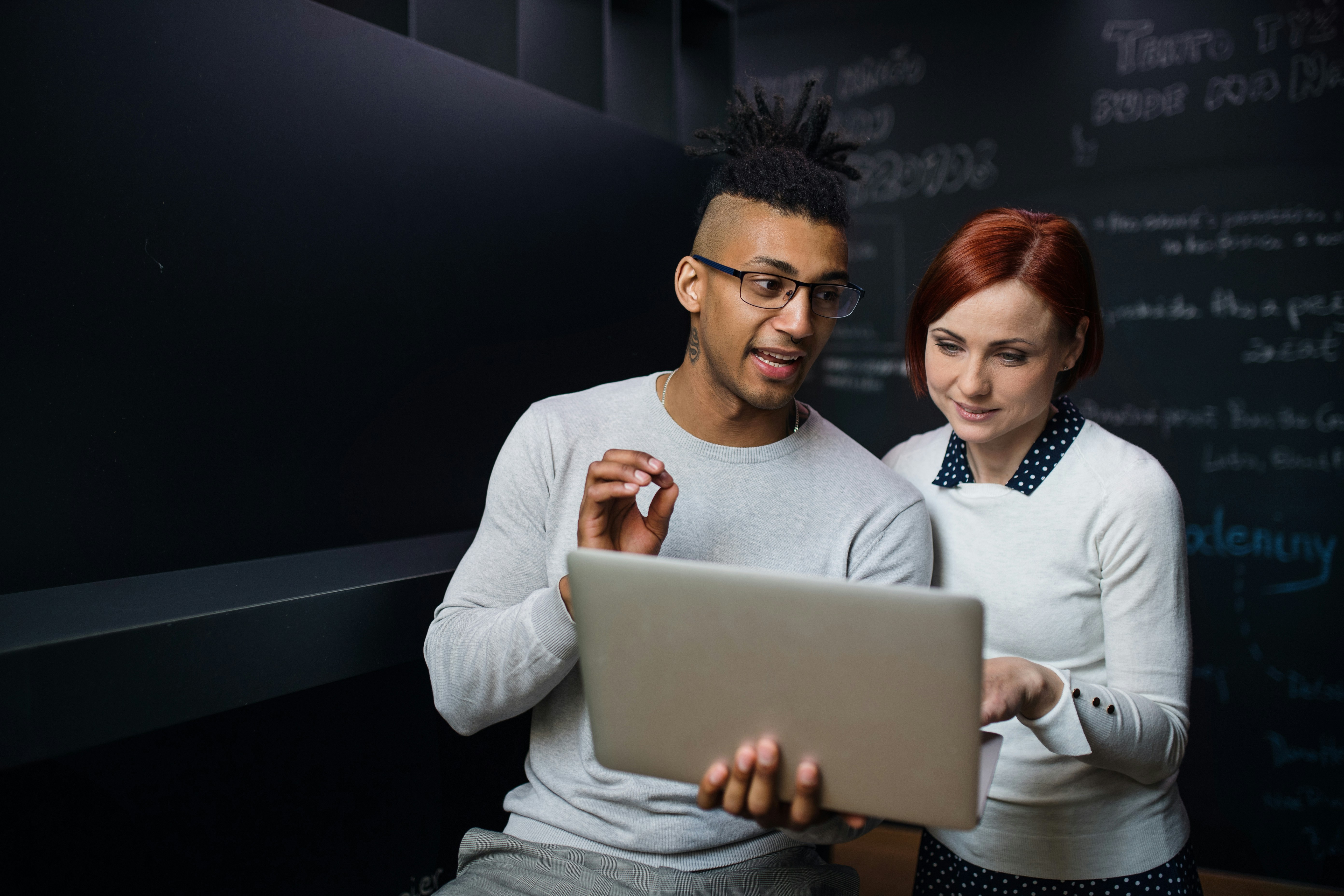 couple reviewing information on computer