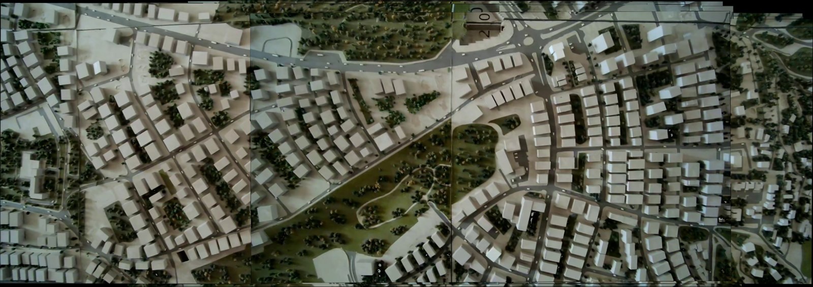 First stitching test, imagery captured over a scale model. No coordinate data is used — each frame is placed relative to its neighbor — and the upper and lower edges of the mosaic step rather than running straight.