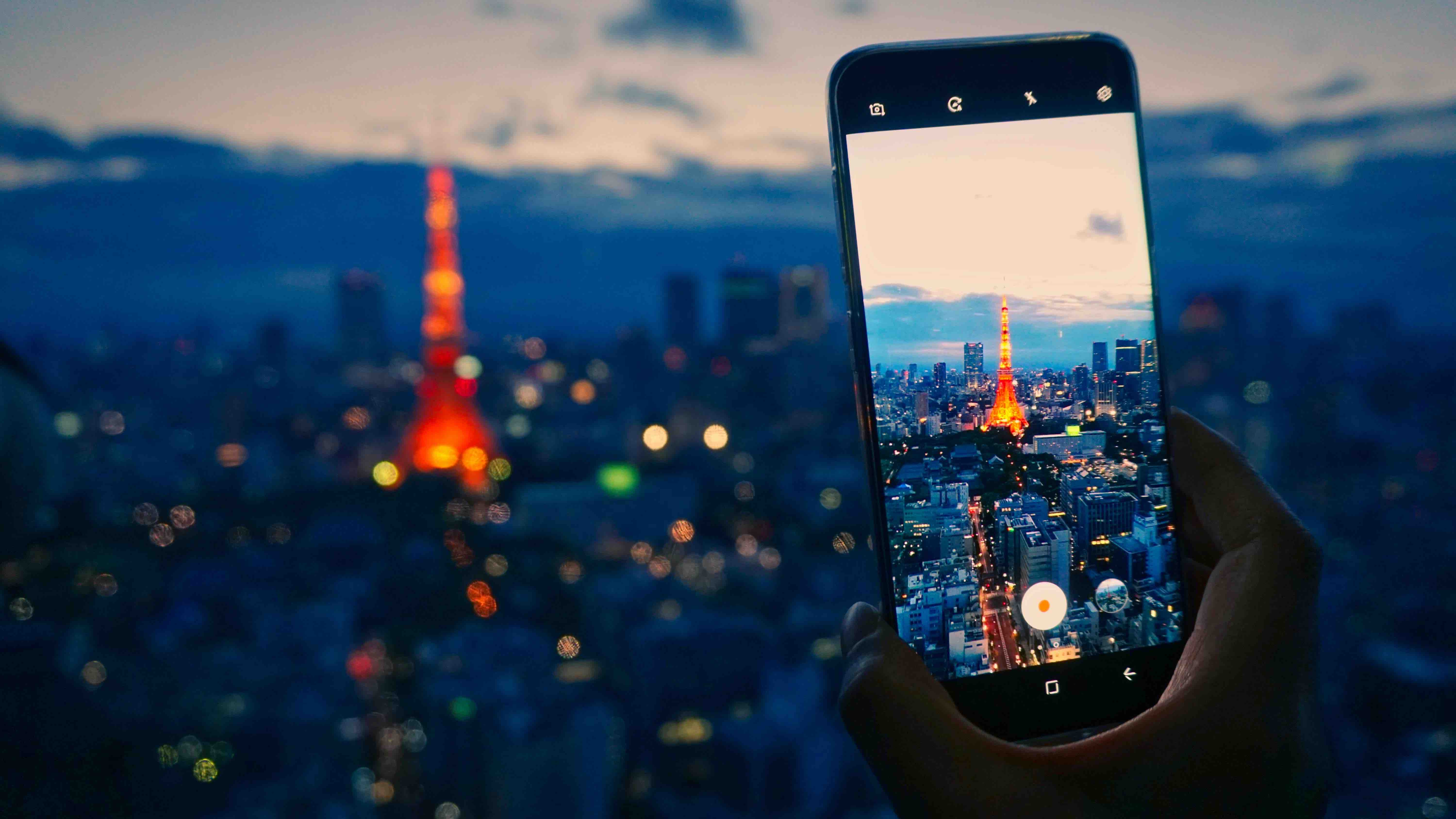 Smart Phone Using their Journey Japan eSIM to take a photo of the Tokyo Tower in Japan