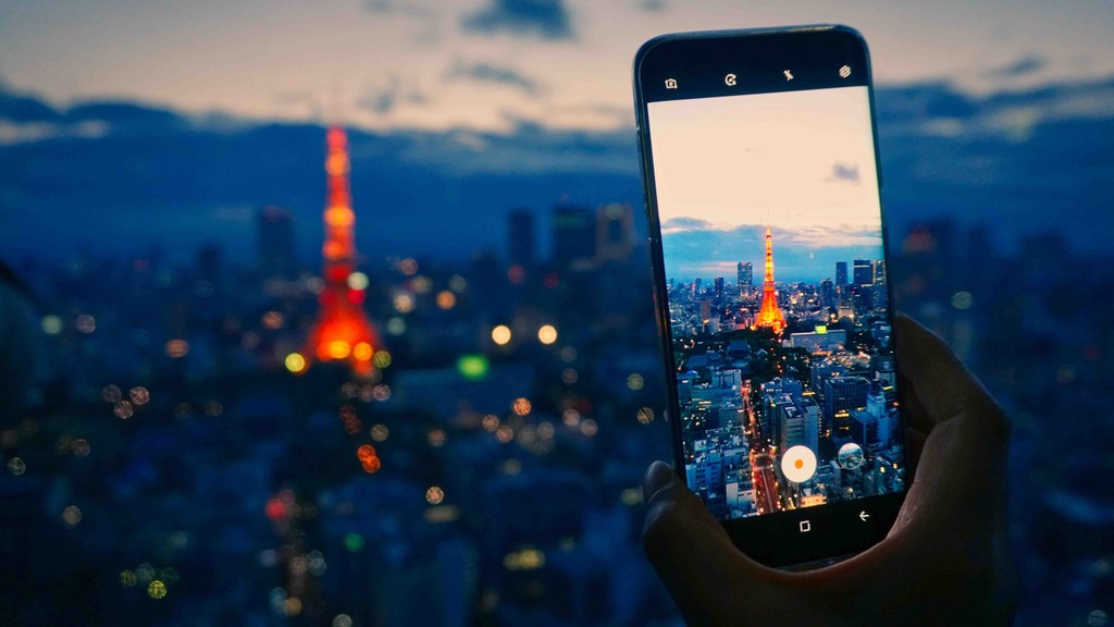 Smart Phone Using their Journey Japan eSIM to take a photo of the Tokyo Tower in Japan