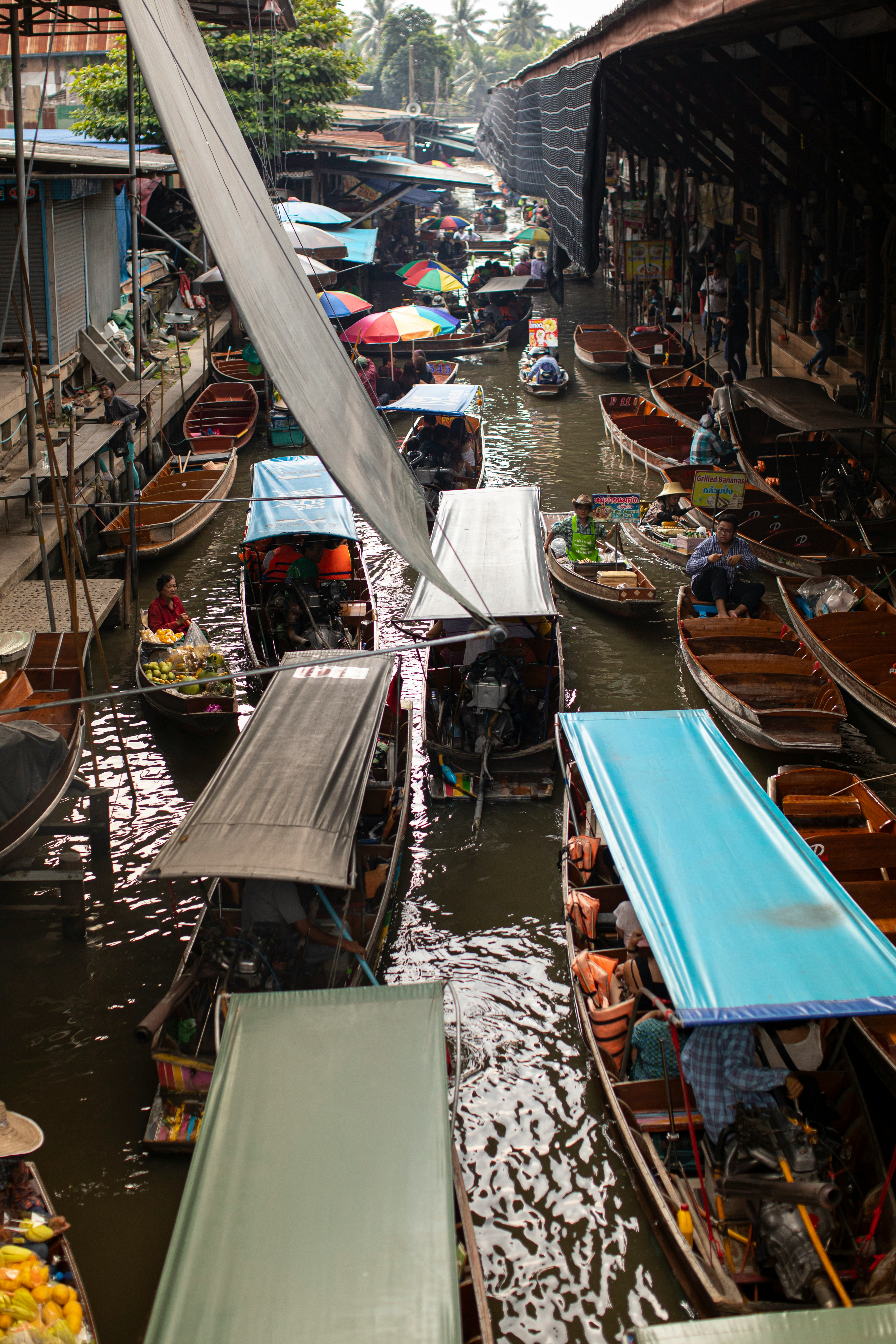 A group of boats that are sitting in the water