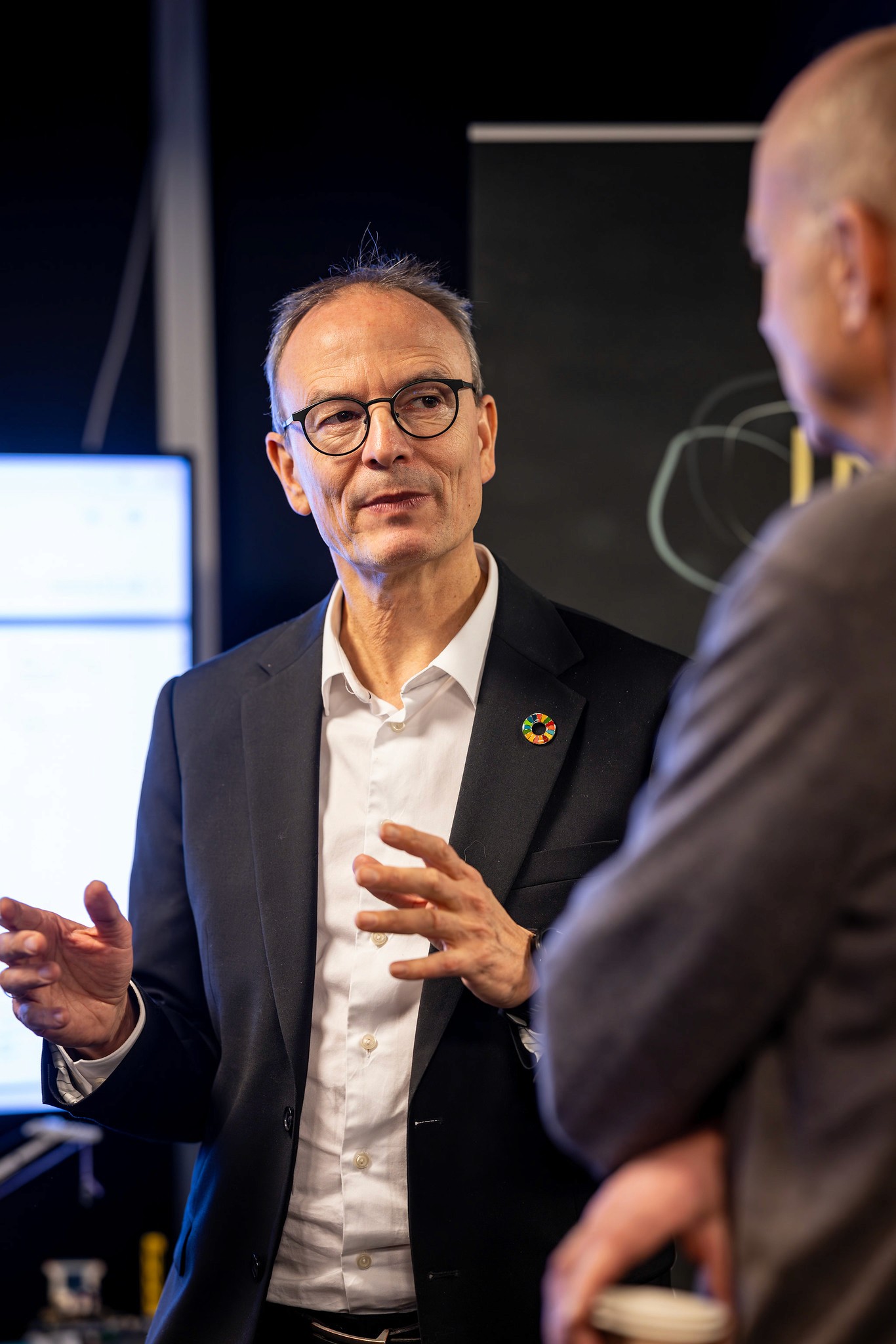 man in black crew neck long sleeve shirt wearing white and black sunglasses