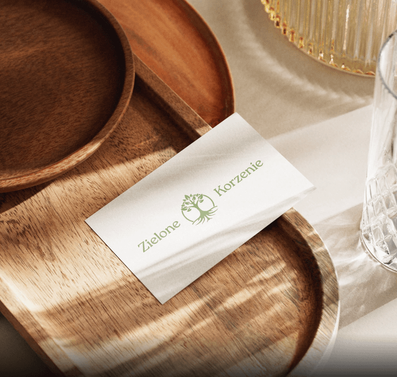 man wearing grey t-shirt standing in front of man sitting on chair