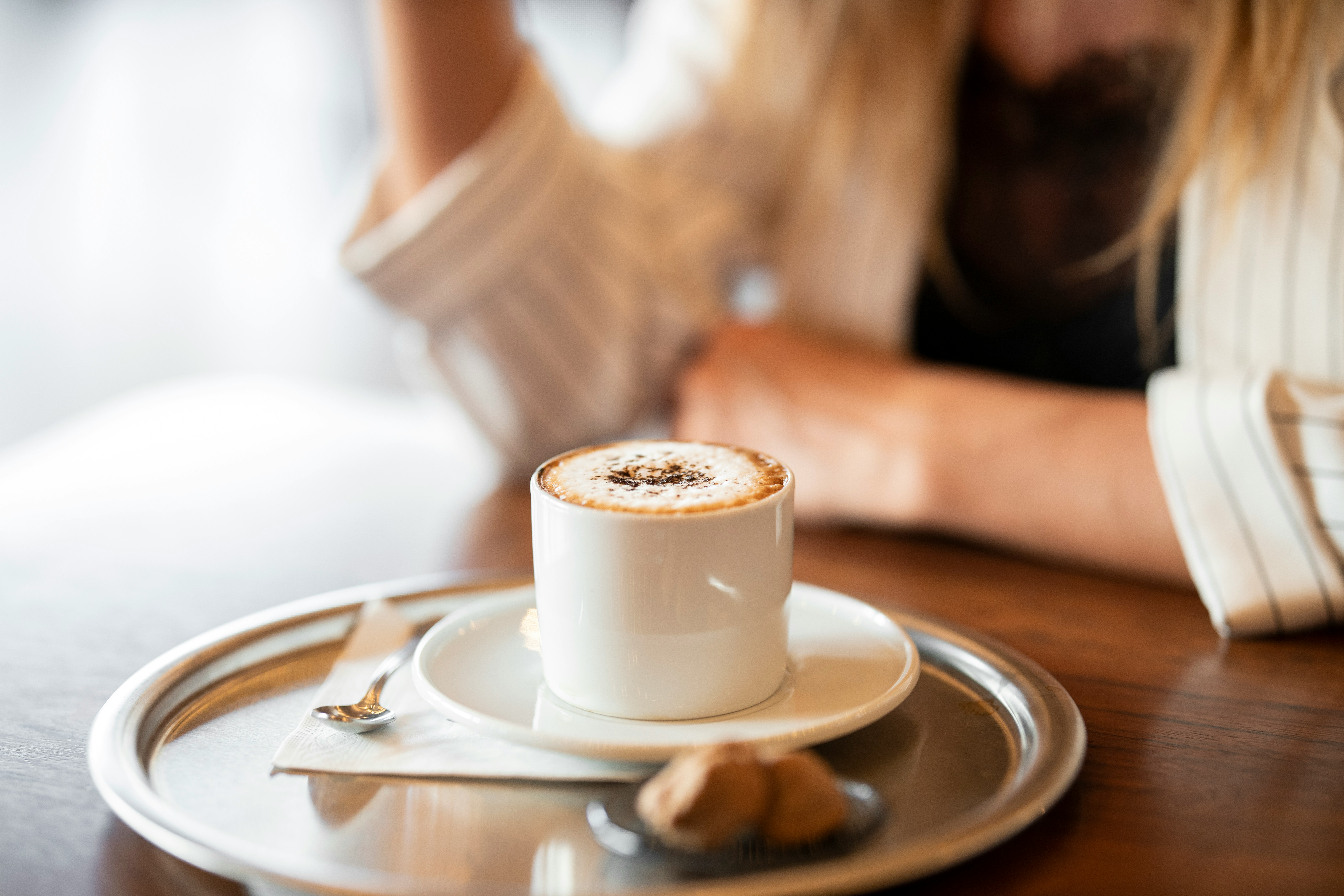 white ceramic cup on white ceramic saucer