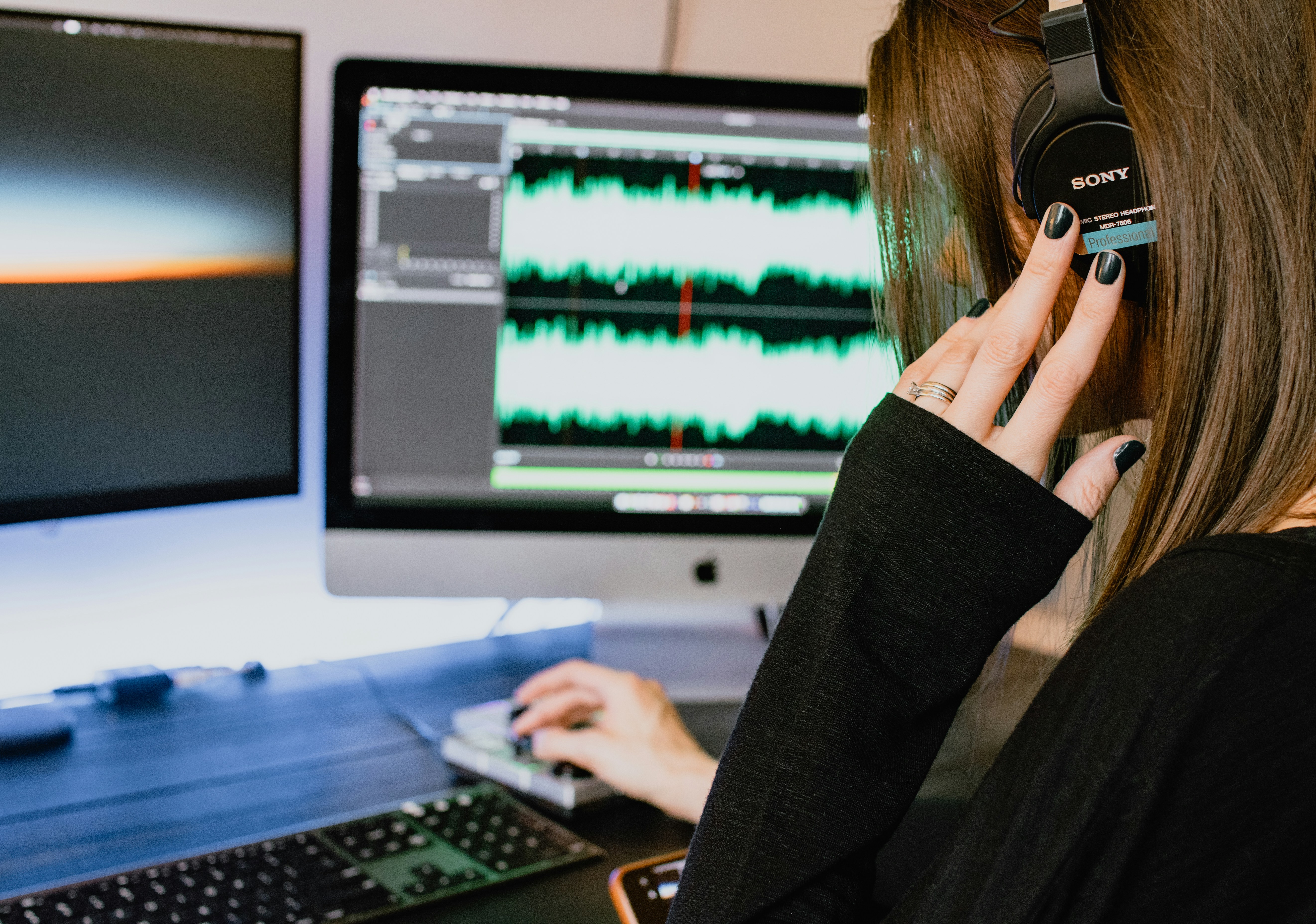 woman listening to her song - AI Voice Cloning App