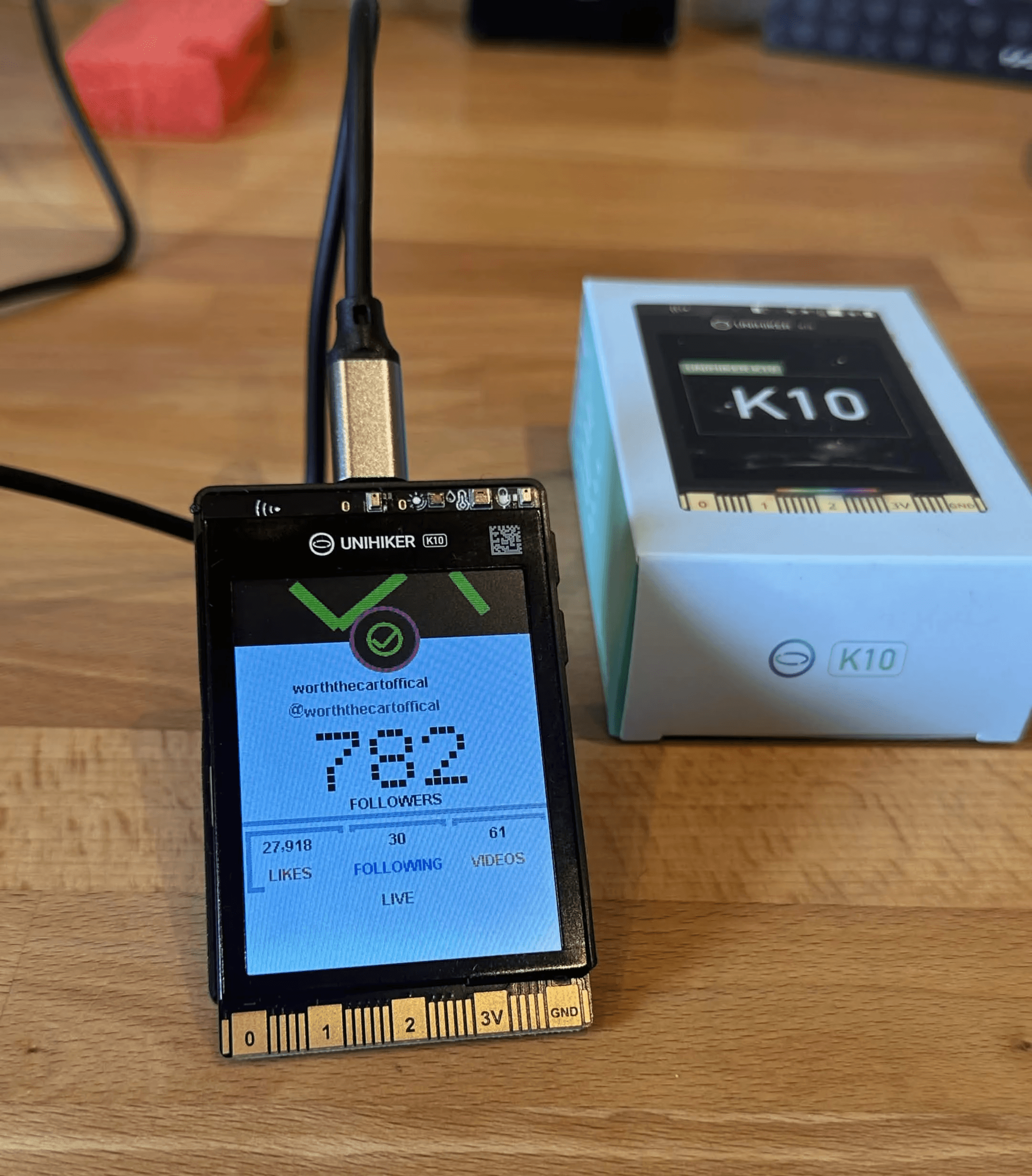 UNIHIKER K10 displaying the live WorthTheCart TikTok follower counter.