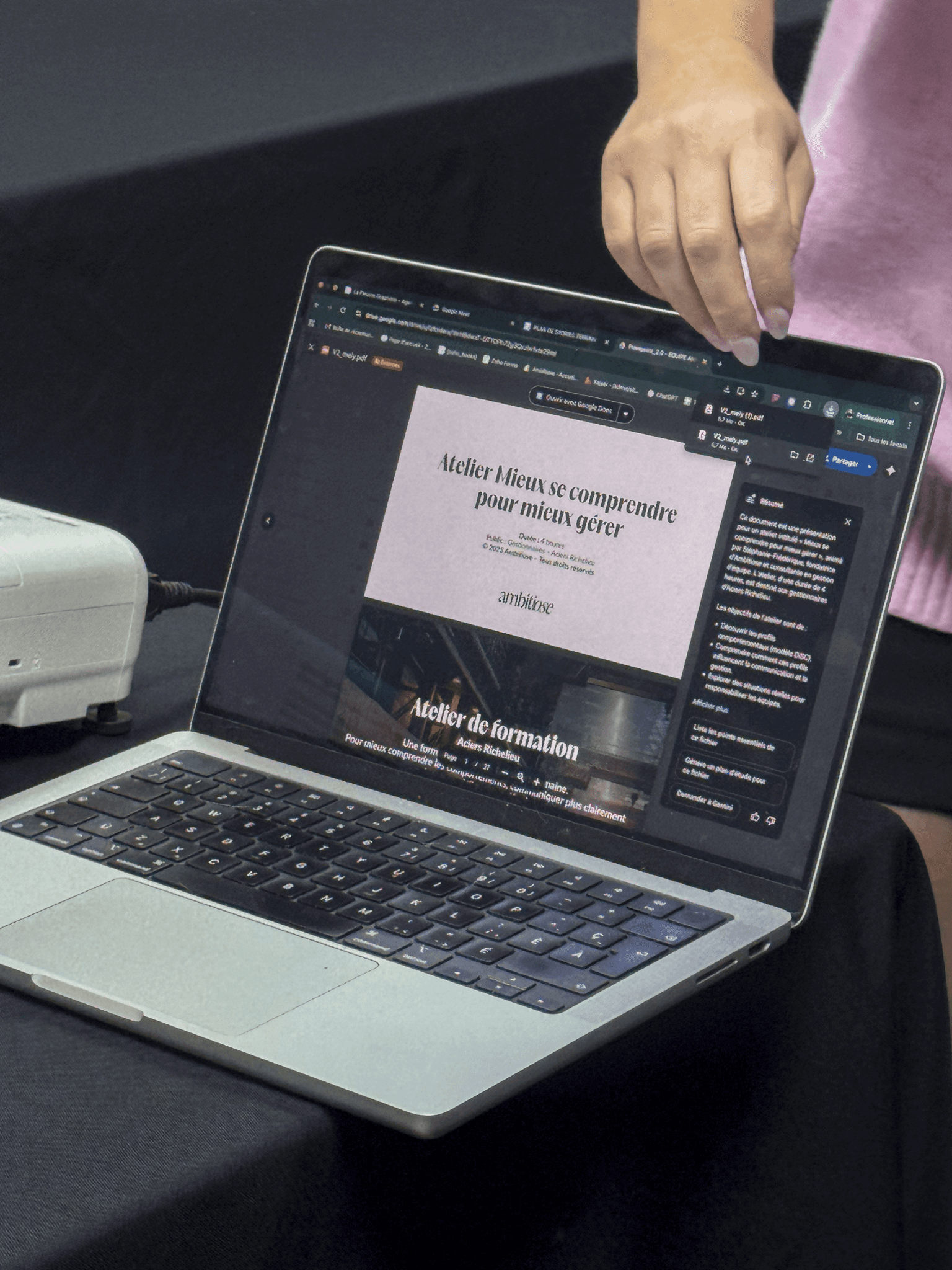 two woman sits on sofa chairs inside house
