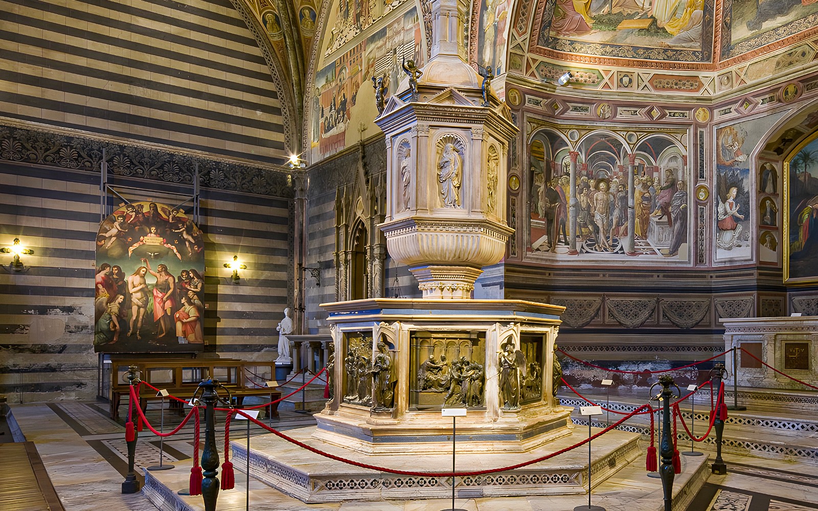 Siena Duomo interior with ornate pulpit and frescoes, part of OPA SI Pass tour.