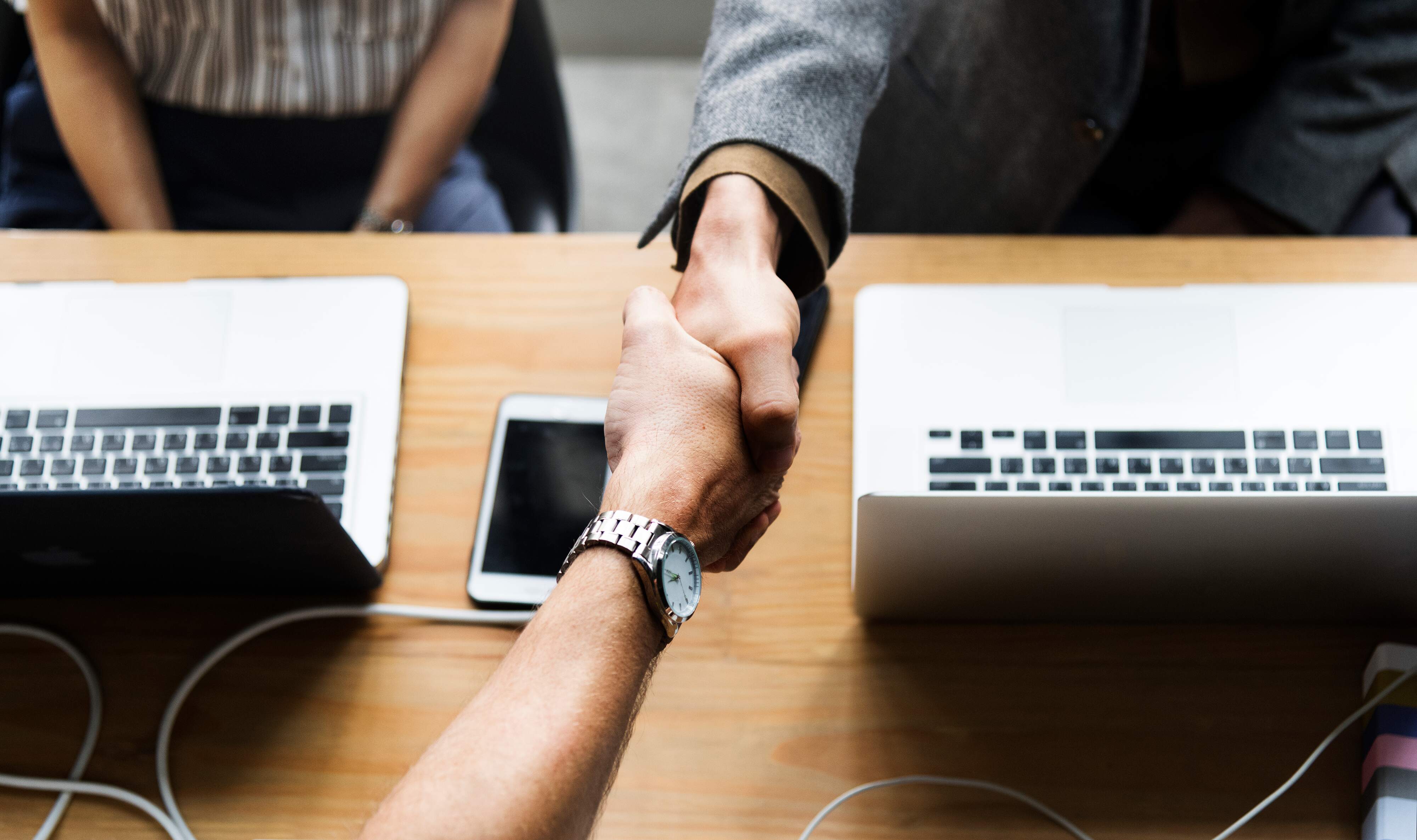 business-people-shaking-hands-agreement