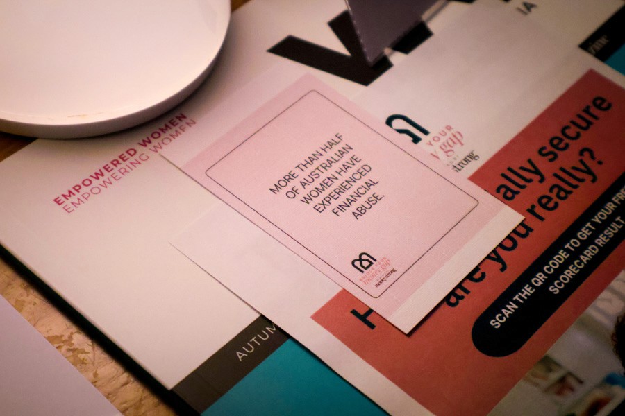 Table card that reads "More than half of Australian women have experienced financial abuse"