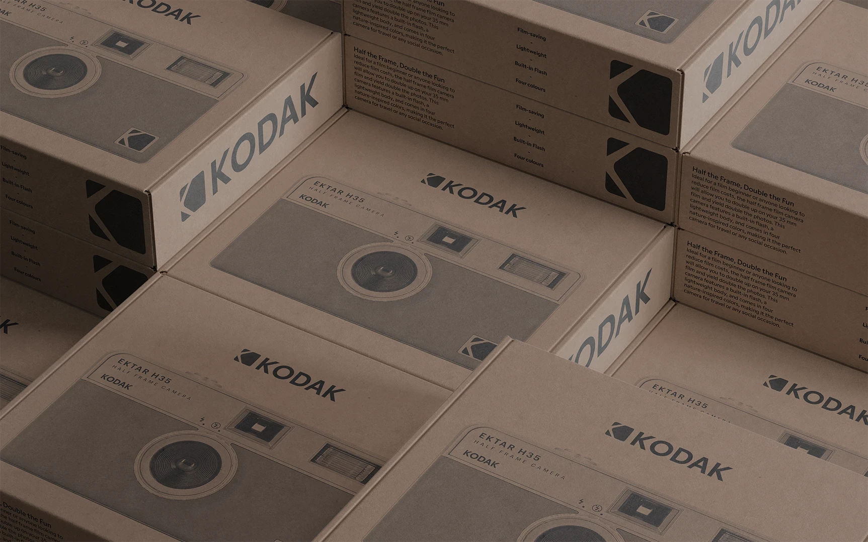 Stacked Kodak-branded cardboard boxes arranged in a warehouse, evoking nostalgia and industrial heritage.