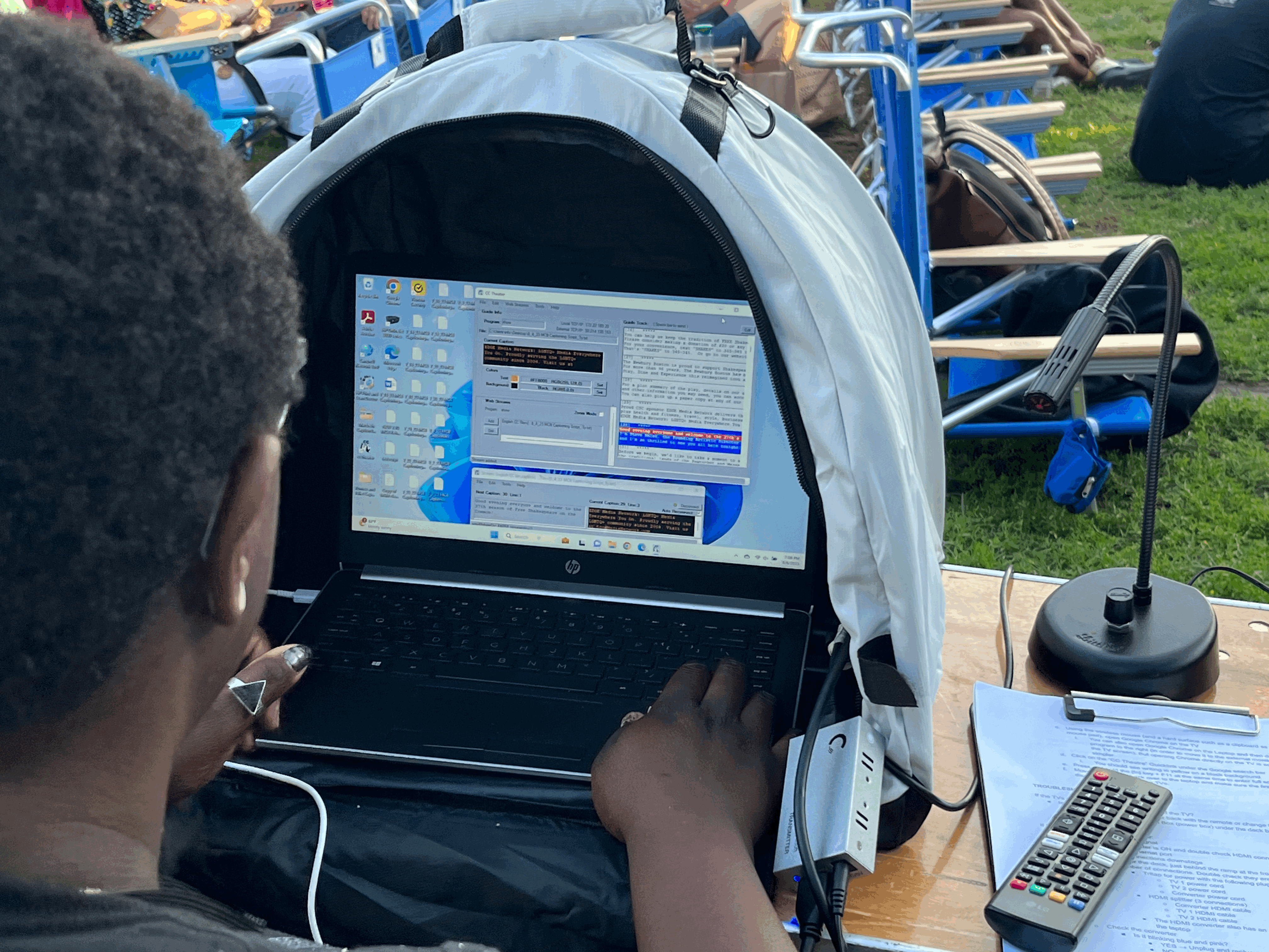 View of a CCTheater operator in front of laptop running the software