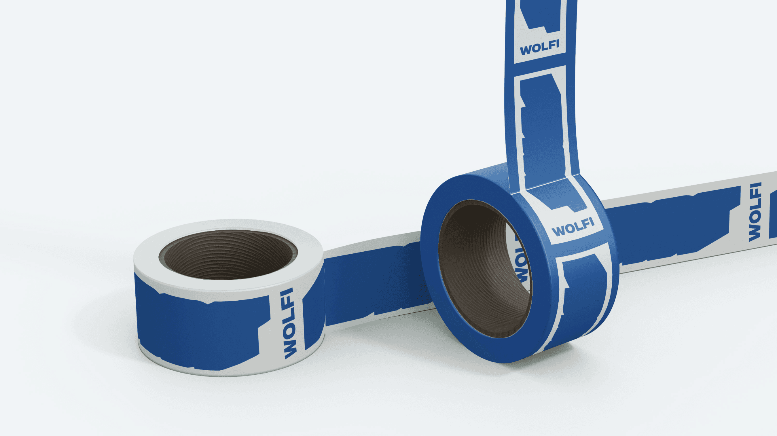 A black and white aerial photo of a surfer riding a wave. The image shows the surfer carving through the water, creating a dynamic spray of water around them.