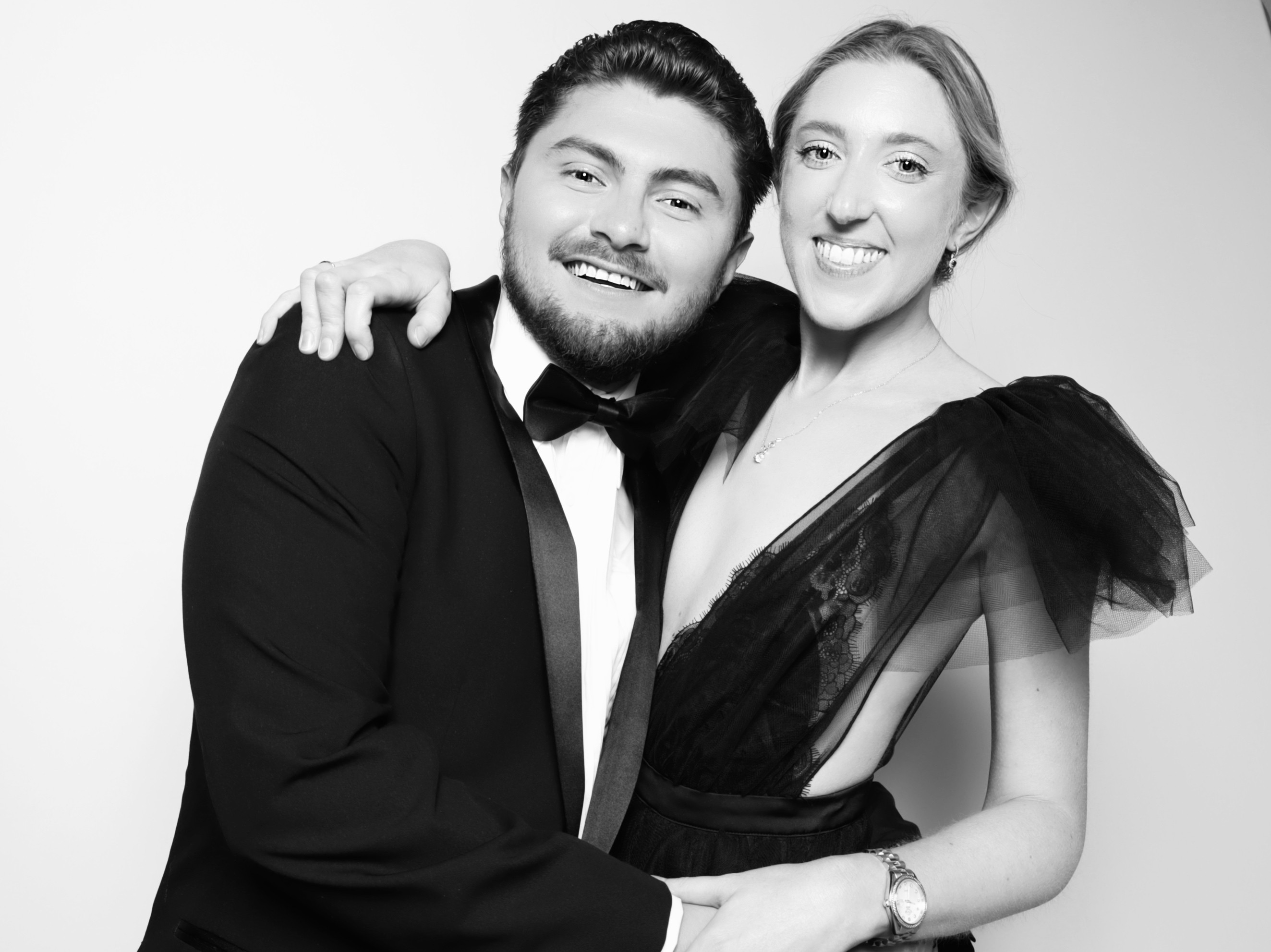 Wedding guests posing for a photo booth portrait at a New England wedding reception.