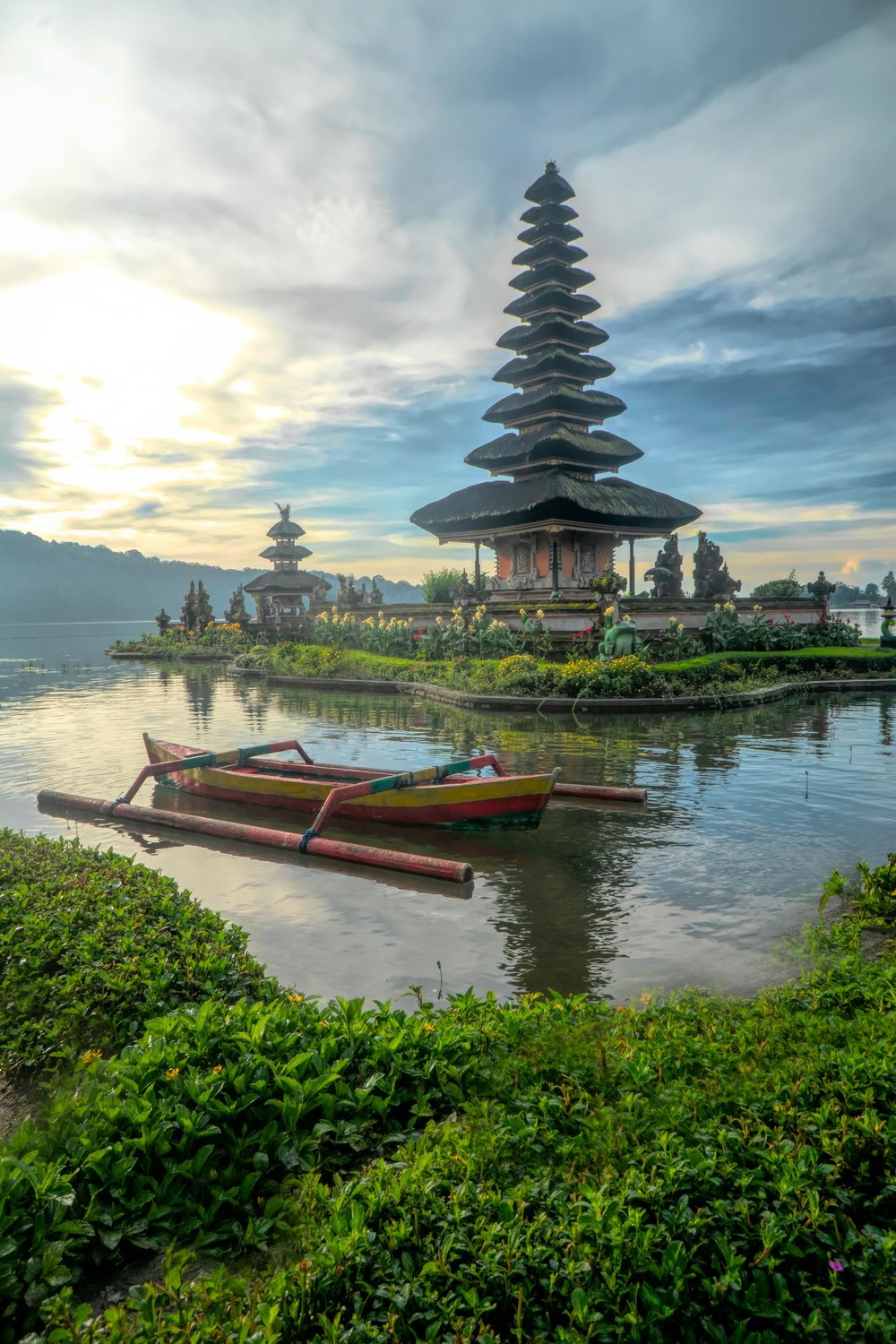 Ulun Danu Beratan temple reflected in a still lake at sunrise in Bali, Indonesia