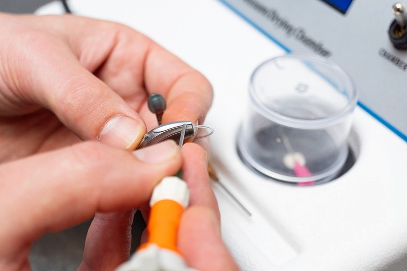 A hearing aid being repaired