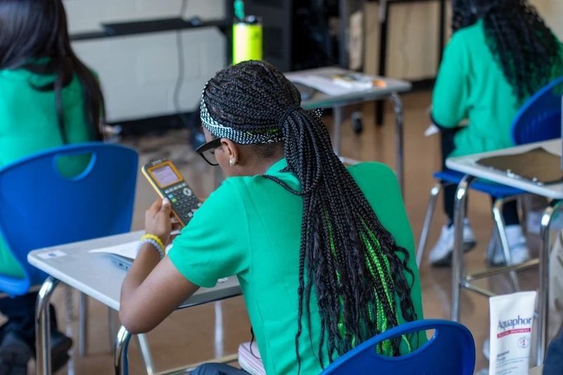 Students at BuffSci working on STEM project with safety gear