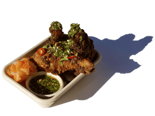 Crispy Vietnamese spring rolls (Gio Chả) served fresh with herbs – popular Asian street food in Auckland.