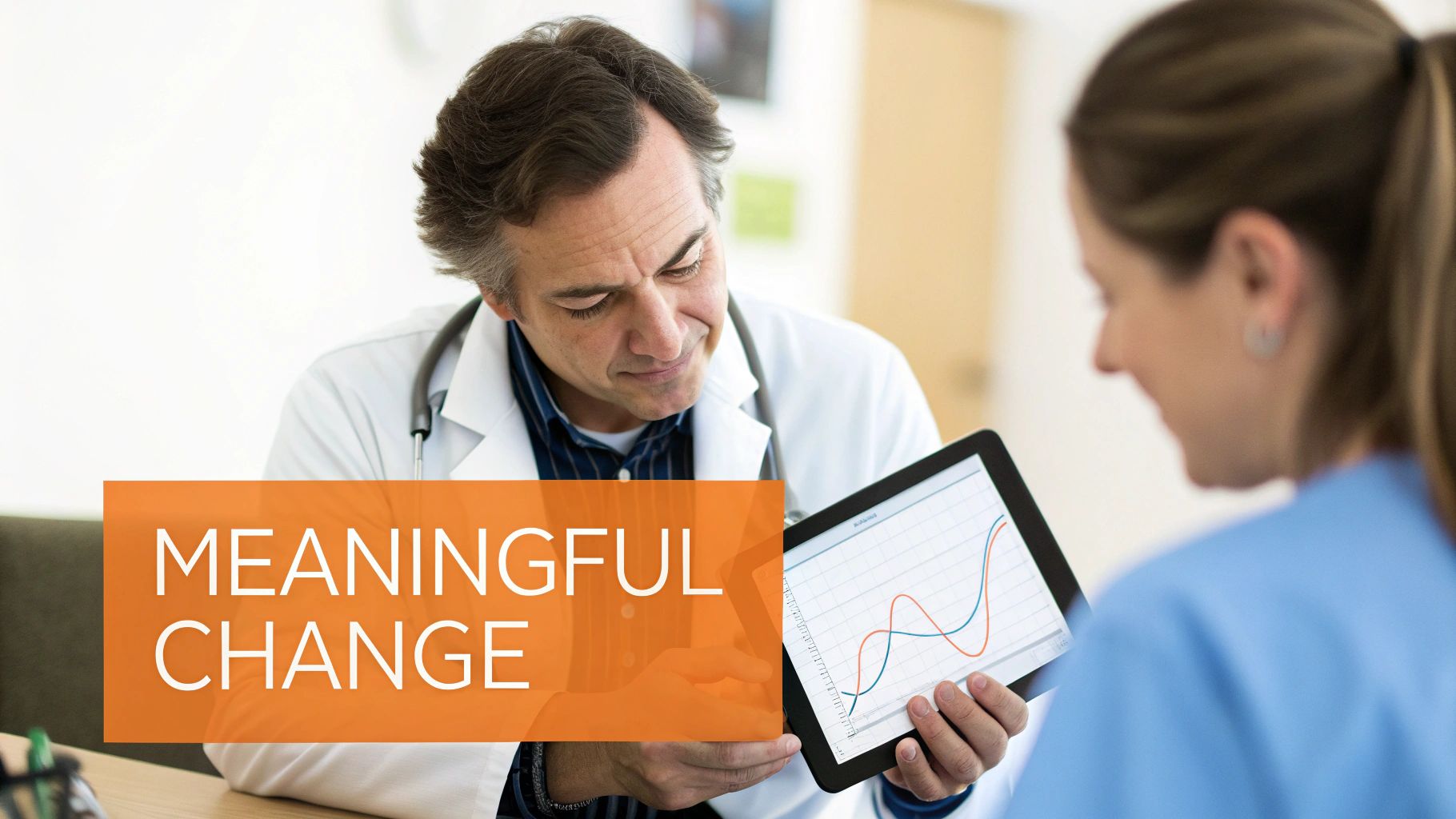 A doctor and nurse examine data on a tablet, symbolizing 'Meaningful Change' in healthcare analytics.