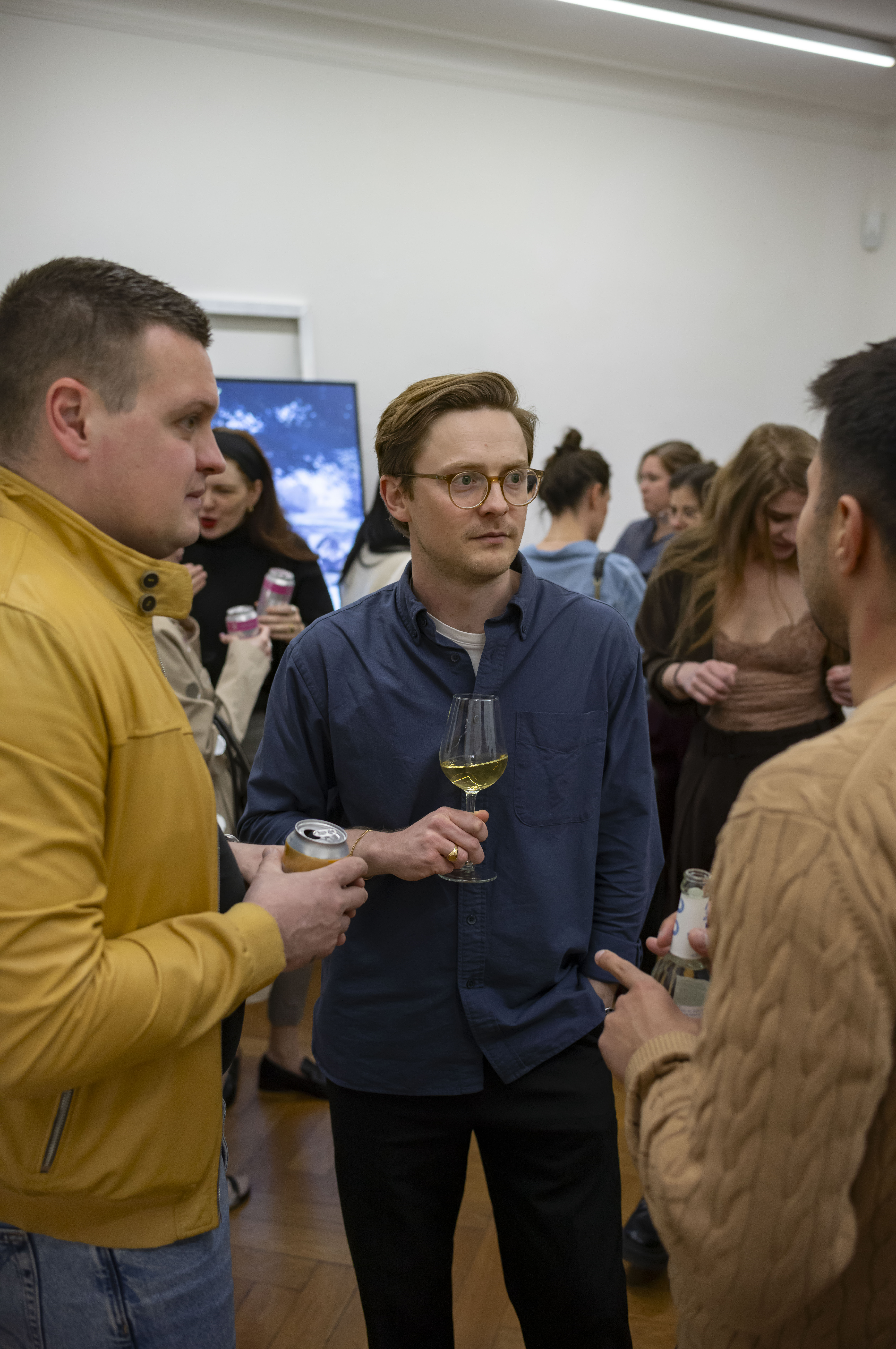 Entrepreneurs engaging in a lively discussion during a Bizz Buzz networking event.