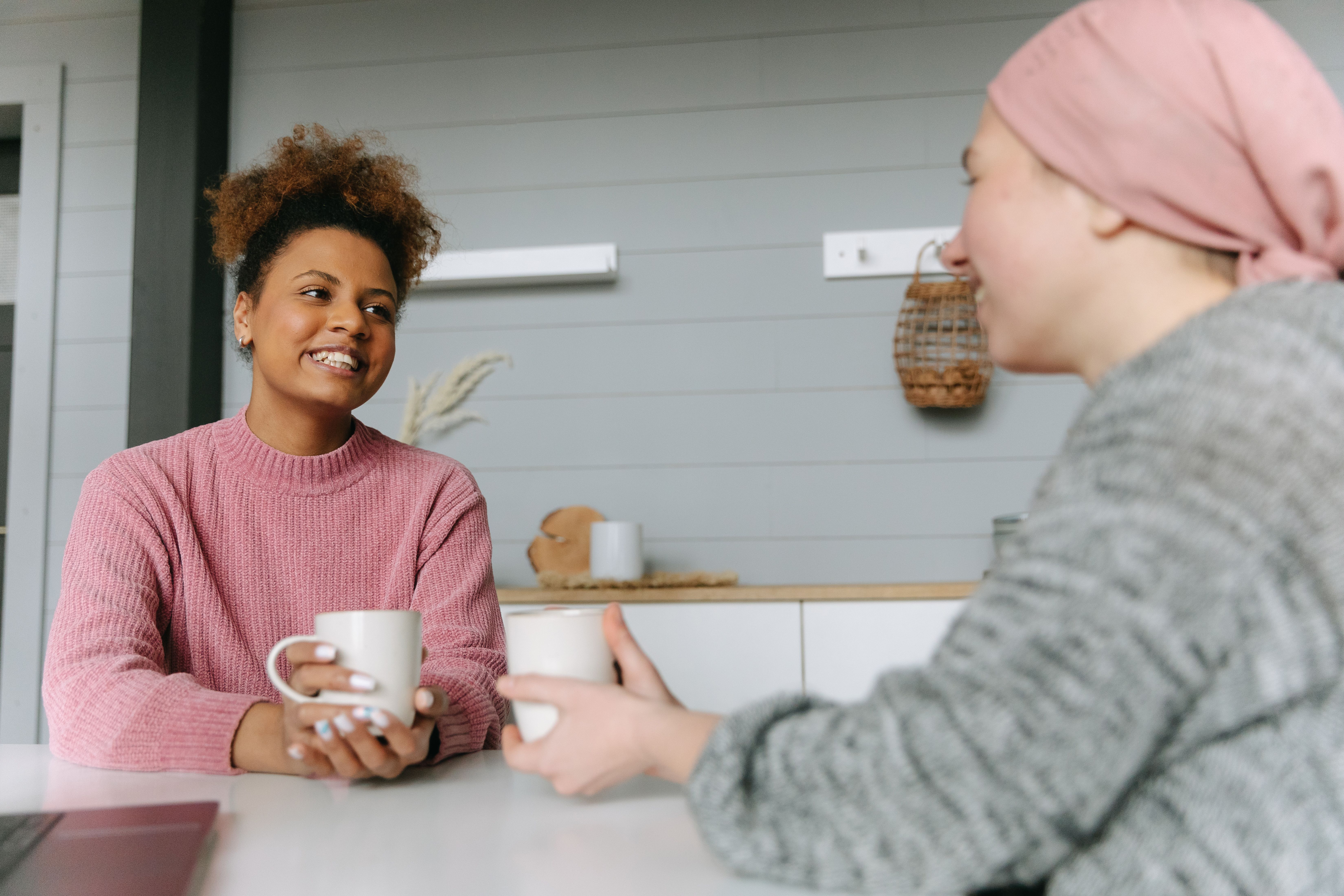 Two women sat talking