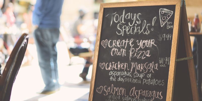 A sign in front of a restaurant showcasing Today's Specials