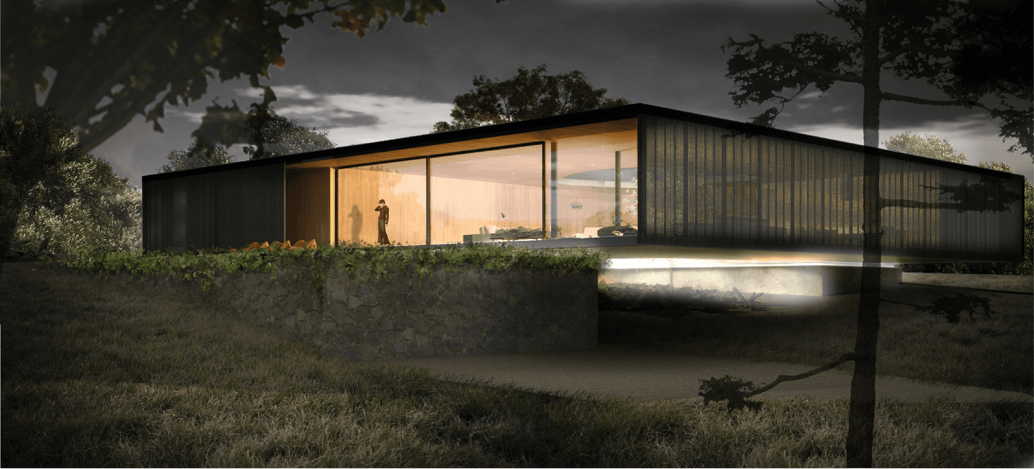 Floating House at dusk: Illuminated upper volume contrasting with the hidden entrance within the natural stone wall at ground level.