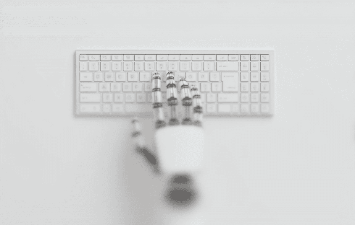 hand of robot click in the keyboard