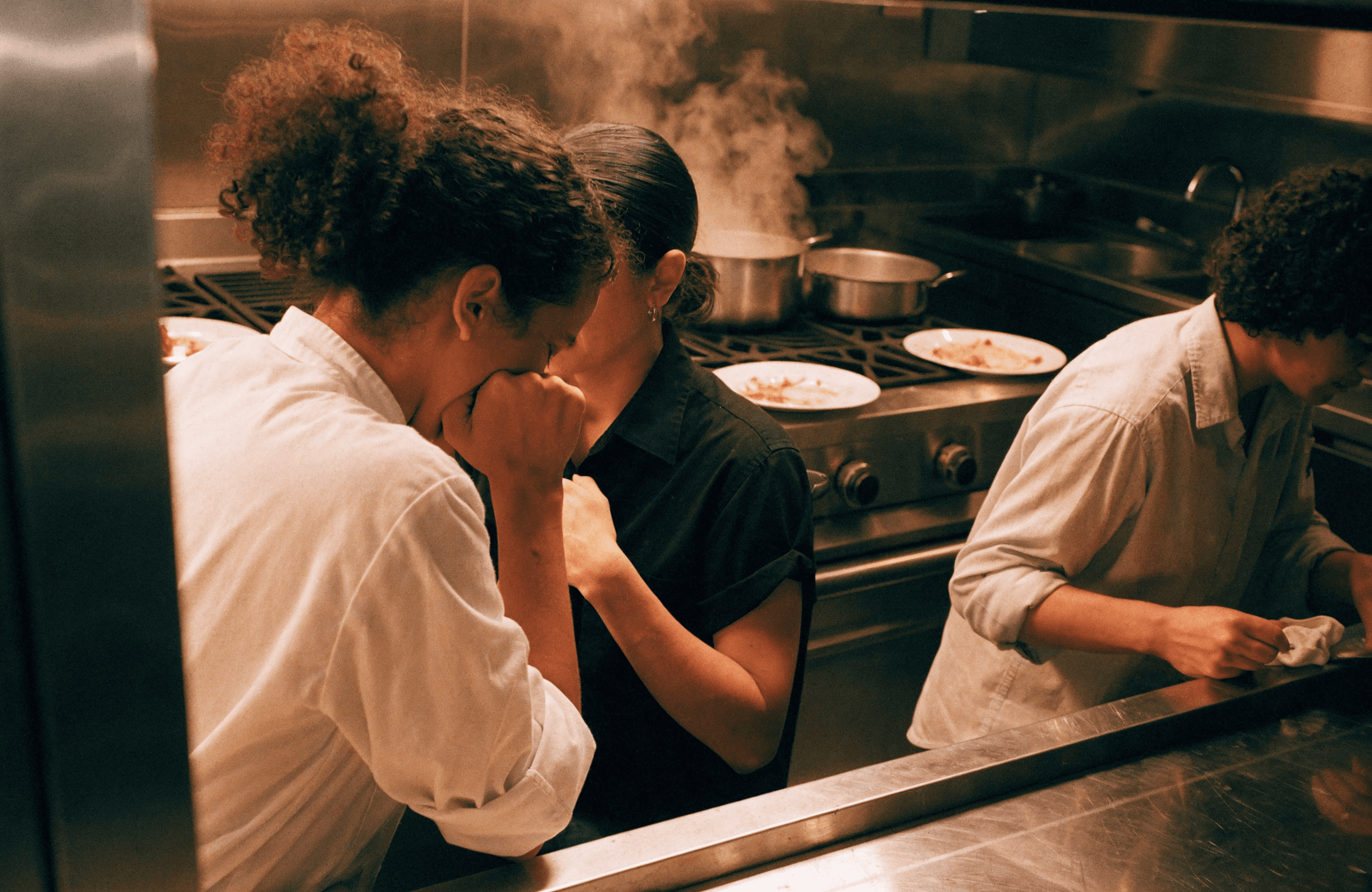 Kitchen team coordinating during dinner service