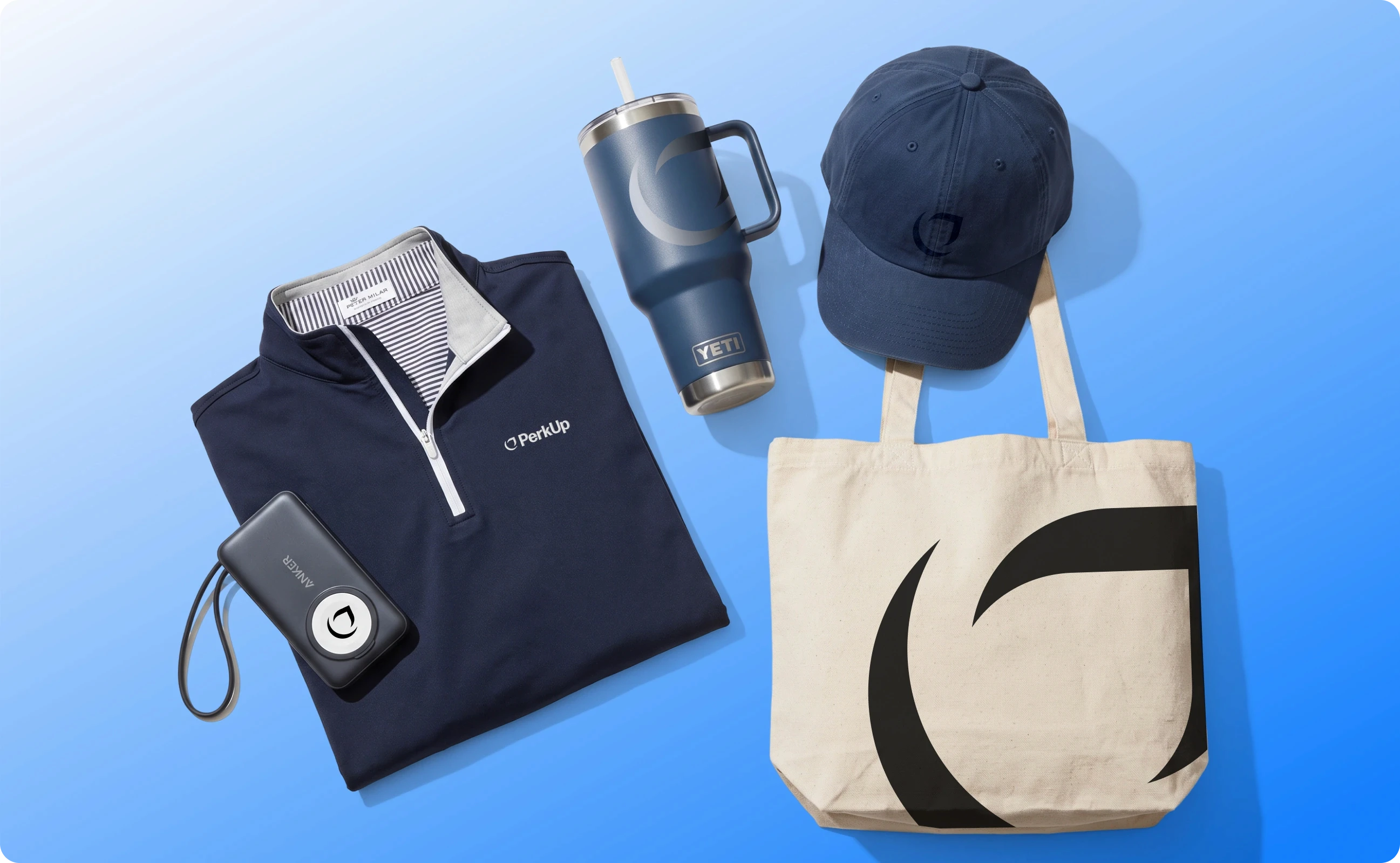 Swag items including a powerbank, premium apparel, tumbler, hat, and tote bag.