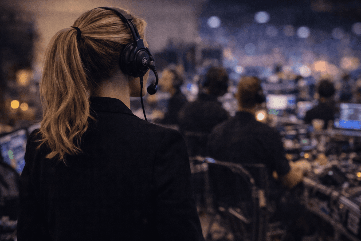 crowd of people sitting on chairs inside room