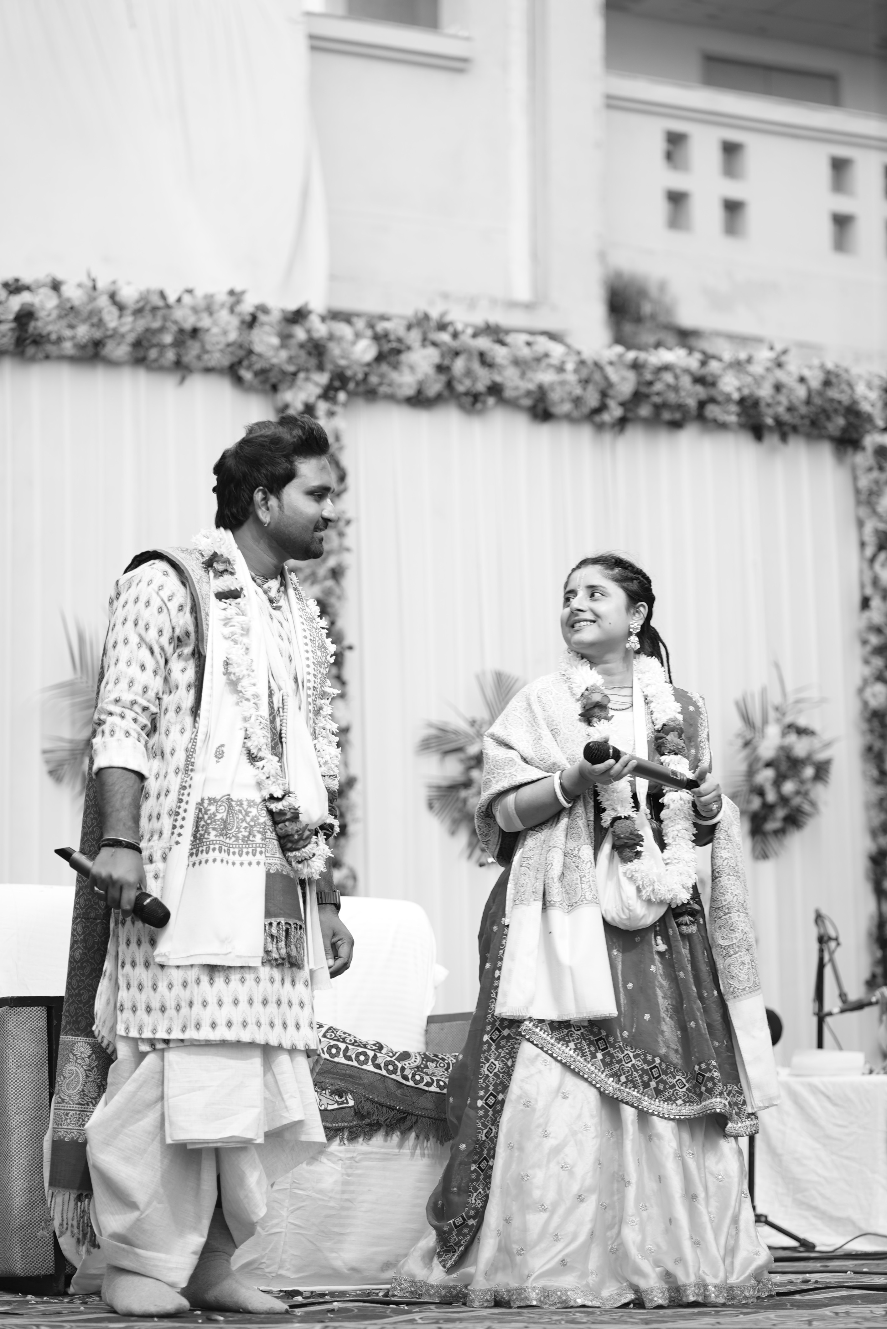 Man rapping into microphone on stage