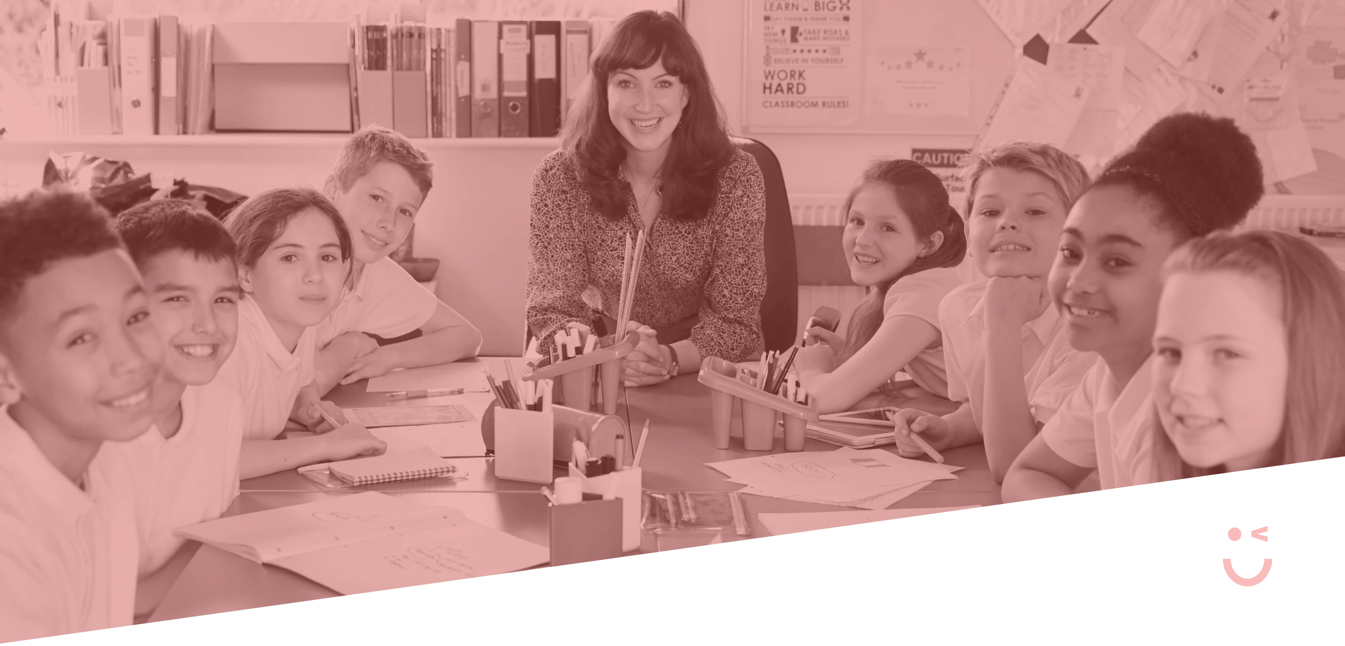 banner of a teacher sitting among her students in classroom