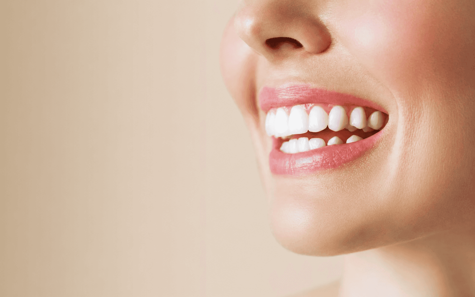 Person smiling warmly in sunlight