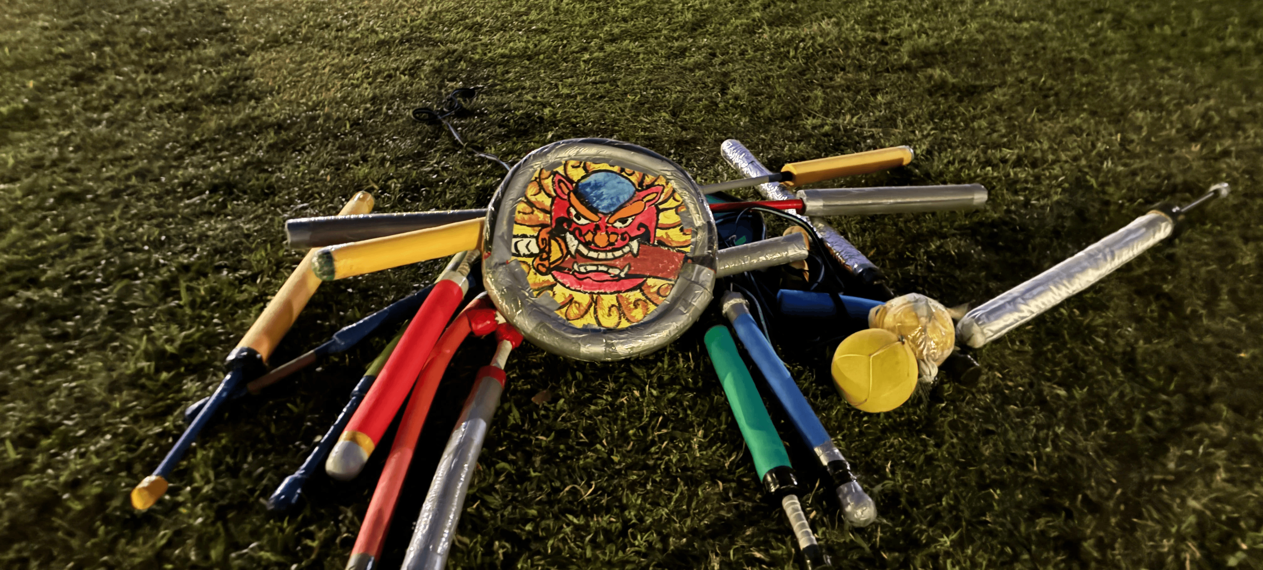 woman holding a phone and man looking at the phone. both are smiling