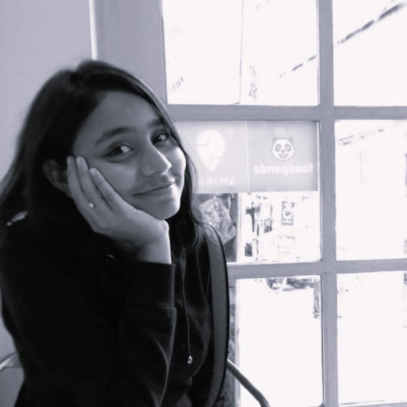 woman wearing white T-shirt smiling