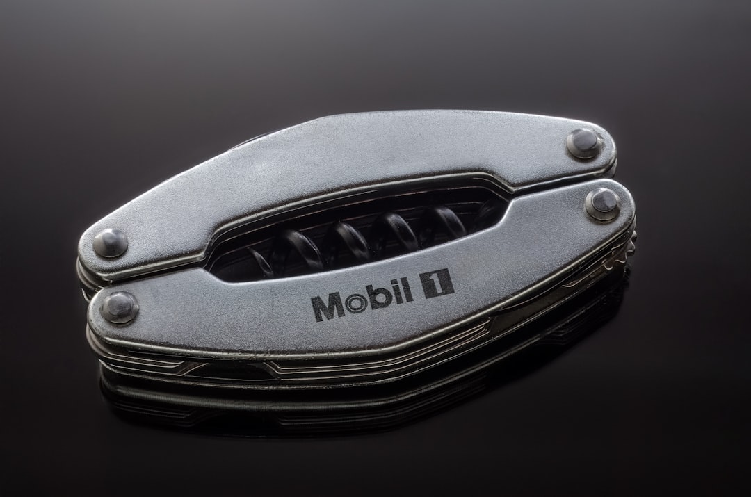 a close up of a metal object on a black surface