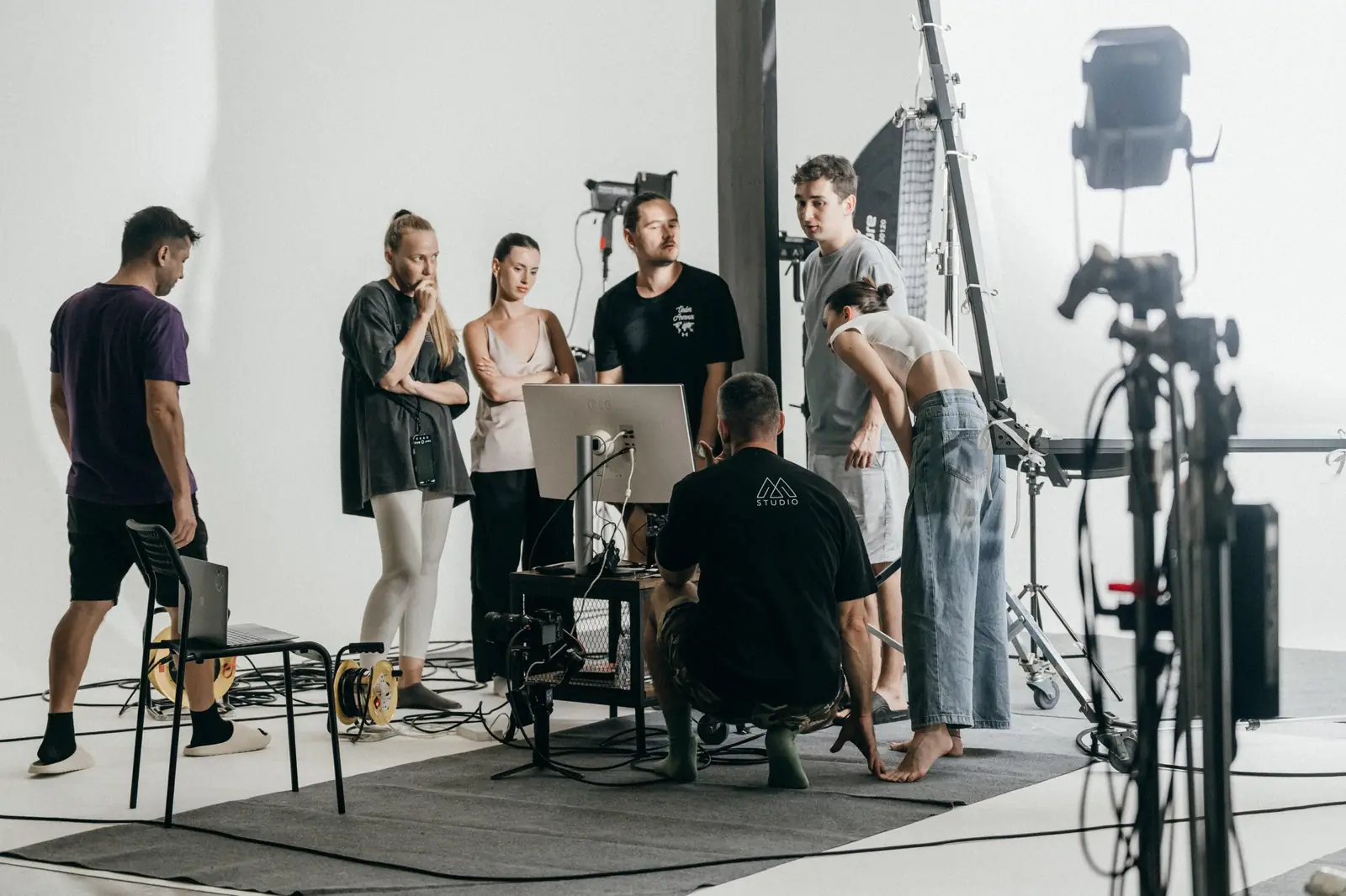 Crew reviewing a take on the monitor during the Neutrogena commercial shoot at MStudio Phuket