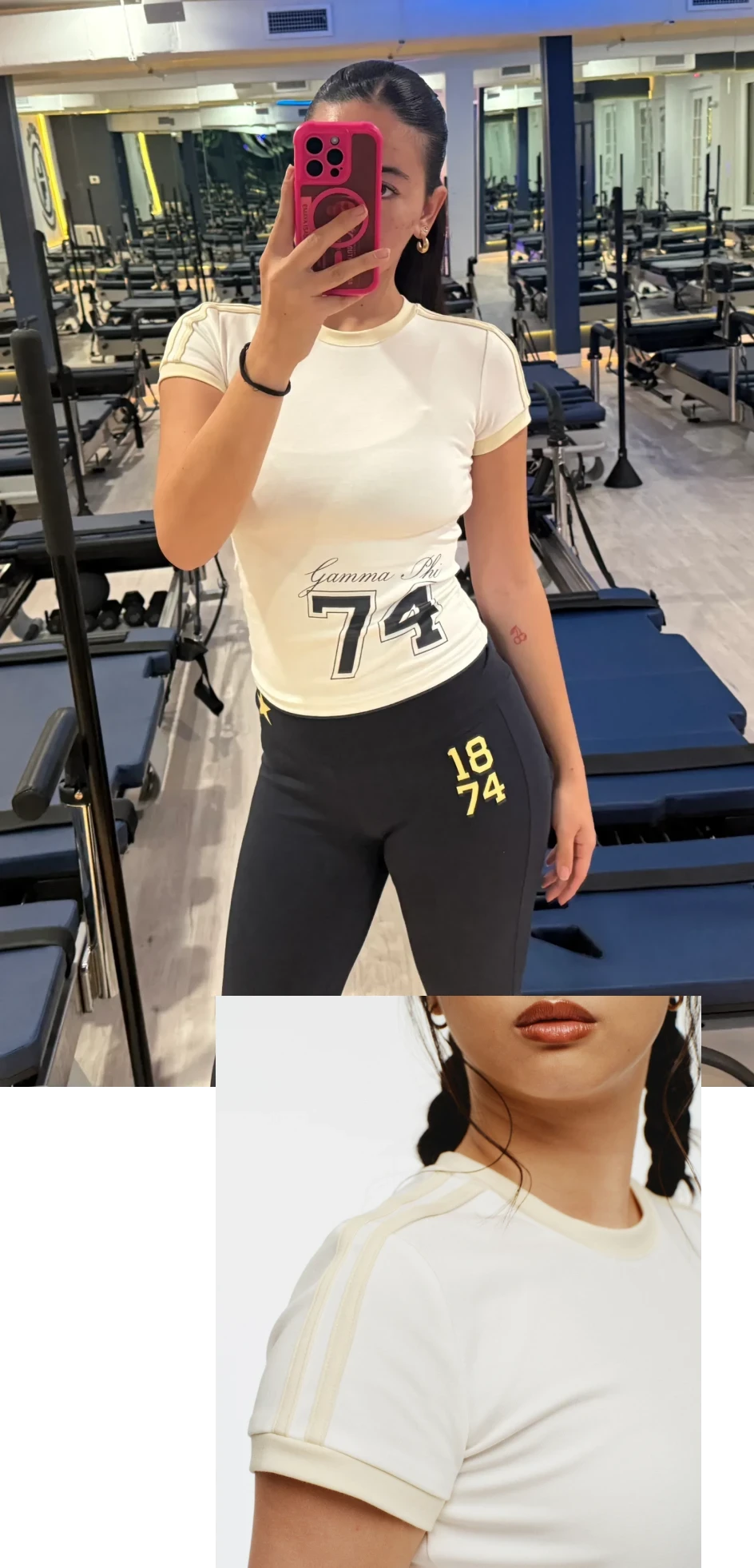 Person taking a mirror selfie in a gym wearing a cream fitted tee (with “Gamma Phi 74”) and dark leggings (yellow “18 74”)